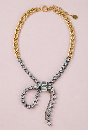 Juicy Couture gilt metal necklace and matching bracelet with bow